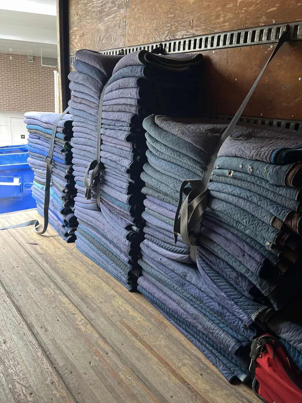 Quilted moving blankets ready for furniture protection