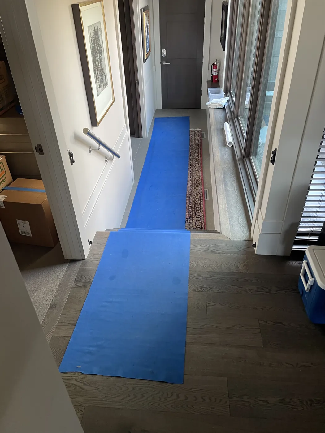 Protective floor runners along hallways and stairs