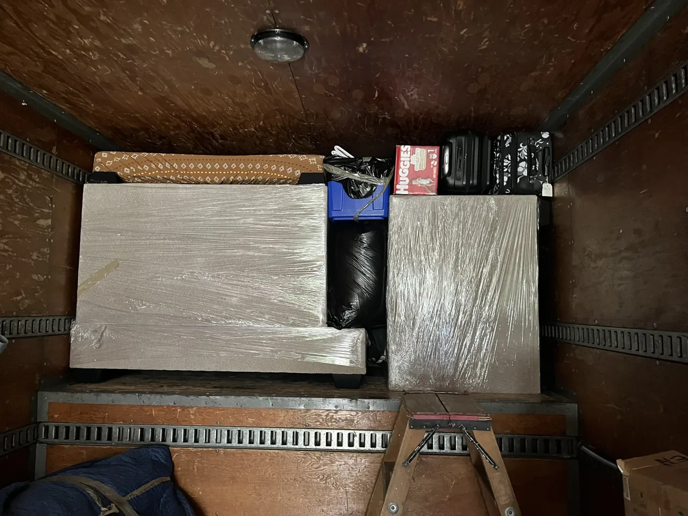 Protected belongings arranged inside a moving truck