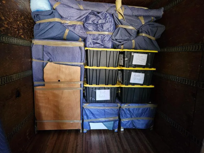 Protected belongings arranged inside a moving truck