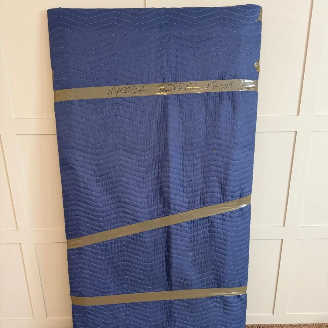 Furniture secured in padded protective moving materials