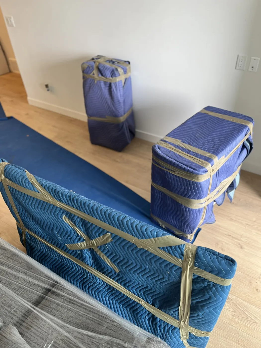 Furniture secured in padded protective moving materials