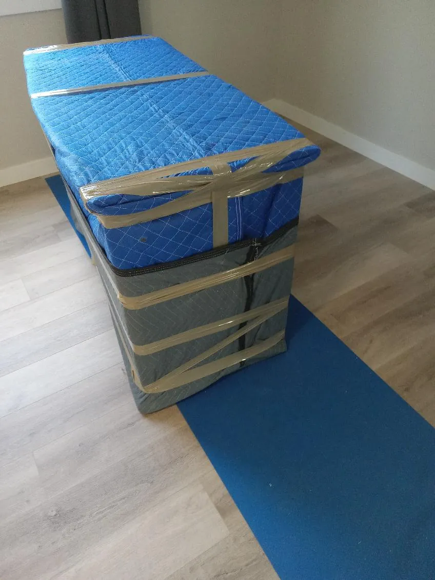 Furniture secured in padded protective moving materials